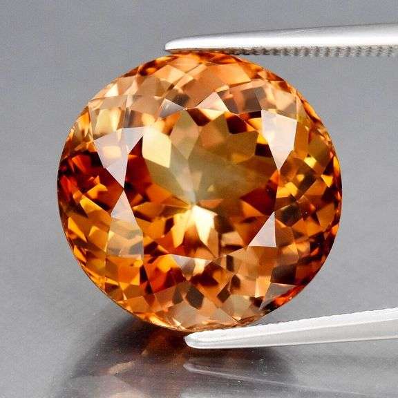 Impressive 12.53ct full fire VS Imperial Topaz solitaire