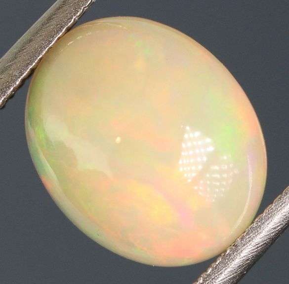 Brilliant flashing 1.83ct semi-black Opal