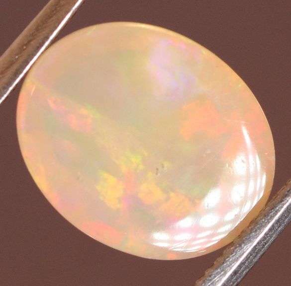 Brilliant flashing 1.83ct semi-black Opal