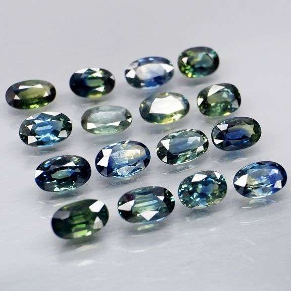 Heated only! 4.99ct blue green sapphire set