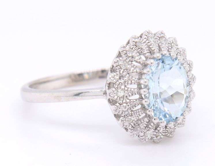 Gorgeous White Gold oval Aquamarine and accent Diamond Halo Ring