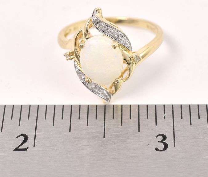 Alluring 10K Yellow Gold approx. 1.18 CTS Opal and Diamond Ring