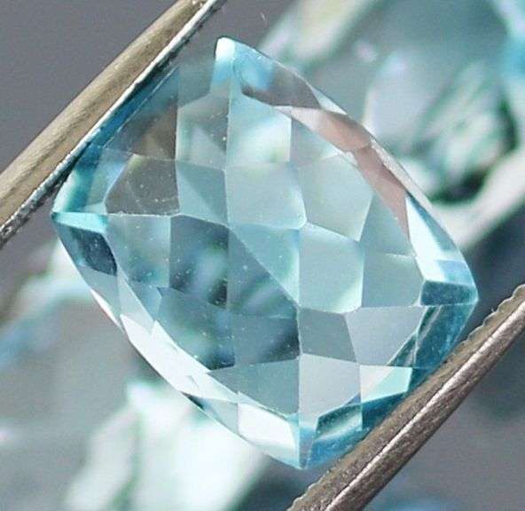 Dazzling 8.58ct vivid blue cushion cut Topaz set
