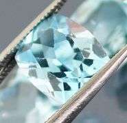Dazzling 8.58ct vivid blue cushion cut Topaz set