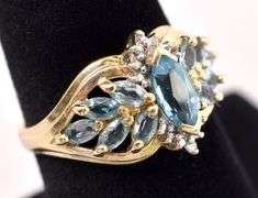 Glistening 10K Yellow Gold Blue Topaz and Diamond Ring