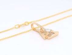 14kt Yellow gold diamond triangle shaped pendant on chain