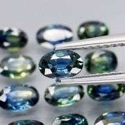 Heated only! 4.99ct blue green sapphire set