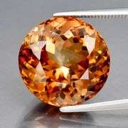 Impressive 12.53ct full fire VS Imperial Topaz solitaire