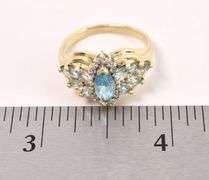 Glistening 10K Yellow Gold Blue Topaz and Diamond Ring