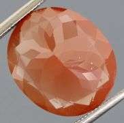 Large collectors 6.77ct blood orange Andesine Labradorite