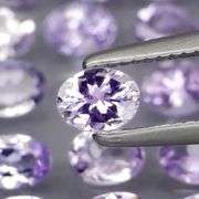 Heavy flashing 4.98ct oval cut Tanzanite set