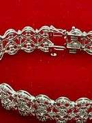 CERTIFIED 14K WHITE GOLD AND DIAMOND BRACELET.