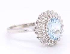 Gorgeous White Gold oval Aquamarine and accent Diamond Halo Ring