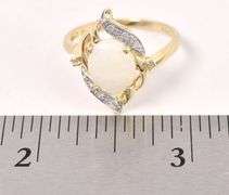 Alluring 10K Yellow Gold approx. 1.18 CTS Opal and Diamond Ring