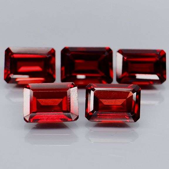 Nice 6.04ct emerald cut cherry red Garnet set