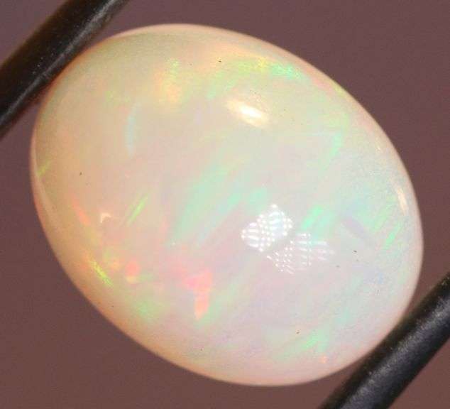 Captivating 6.67ct rainbow flashing Opal