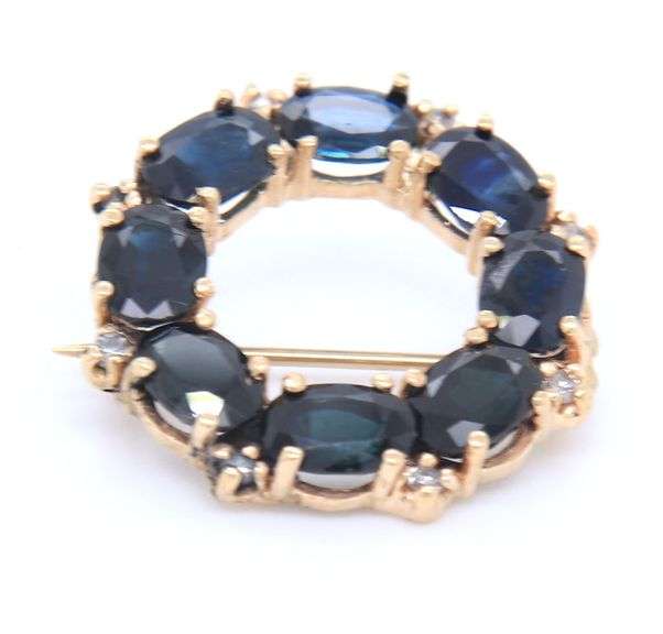 14kt Yellow gold oval blue sapphire and diamond circle brooch