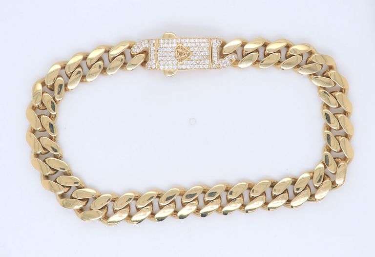 14kt Yellow gold curb link bracelet with cubic zirconia box clasp