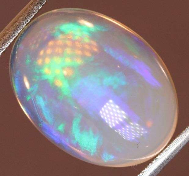 Gorgeous green and indigo flashing 5.03ct Jelly Opal
