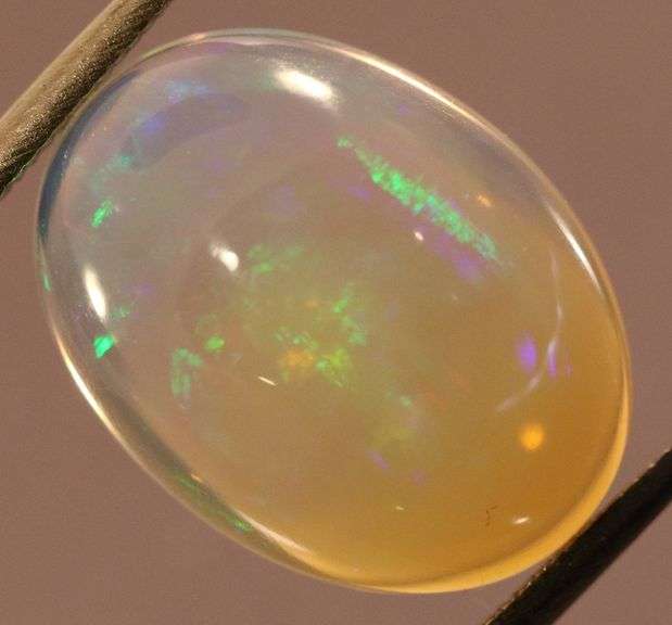 Gorgeous green and indigo flashing 5.03ct Jelly Opal