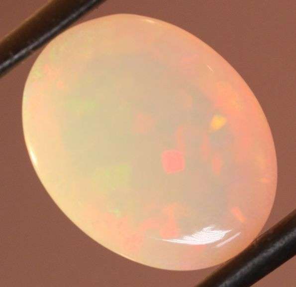 Captivating 6.67ct rainbow flashing Opal
