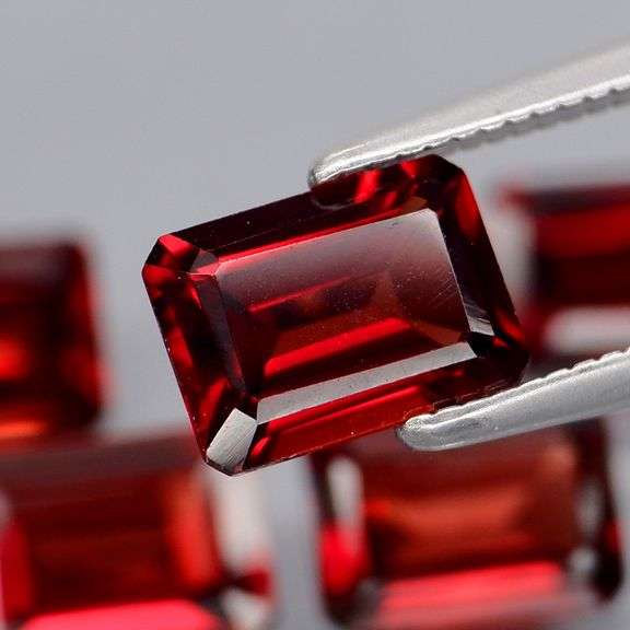 Nice 6.04ct emerald cut cherry red Garnet set