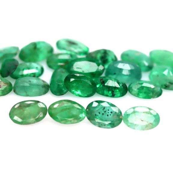 Oval cut 5.28ct Zambian Emerald set