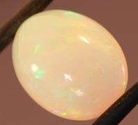 Captivating 6.67ct rainbow flashing Opal