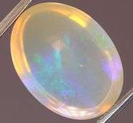 Gorgeous green and indigo flashing 5.03ct Jelly Opal