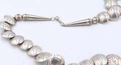Navajo graduated sterling silver pillow turquoise stamped bead necklace