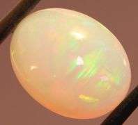 Captivating 6.67ct rainbow flashing Opal