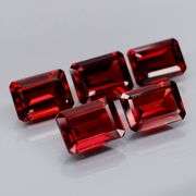 Nice 6.04ct emerald cut cherry red Garnet set