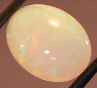 Captivating 6.67ct rainbow flashing Opal