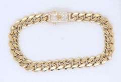 14kt Yellow gold curb link bracelet with cubic zirconia box clasp