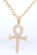 14kt Yellow gold cubic zirconia cross pendant on curb chain link necklace