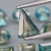 Stunning blue green 4.27ct mixed cut Sapphire set