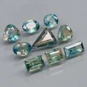 Stunning blue green 4.27ct mixed cut Sapphire set