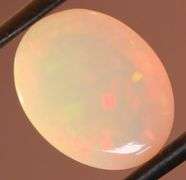 Captivating 6.67ct rainbow flashing Opal
