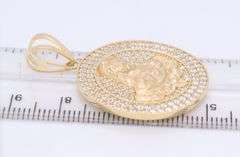 14kt Yellow gold round religious cubic zirconia pendant