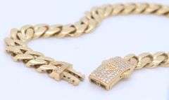 14kt Yellow gold curb link bracelet with cubic zirconia box clasp