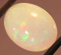 Captivating 6.67ct rainbow flashing Opal