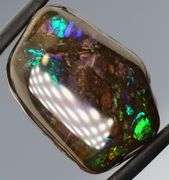 Indigo and green flashing 18.32ct rainbow Ammolite