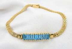 Attractive 14K YG Bracelet with Blue Topaz