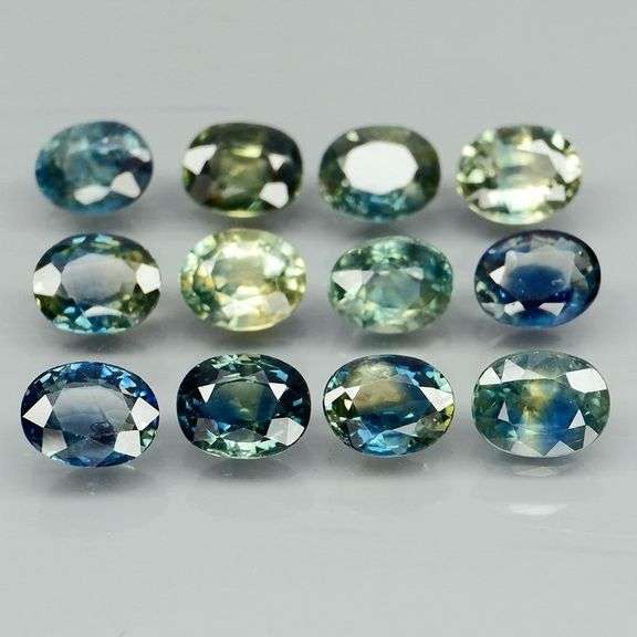 Heated only! 3.80ct blue green sapphire set