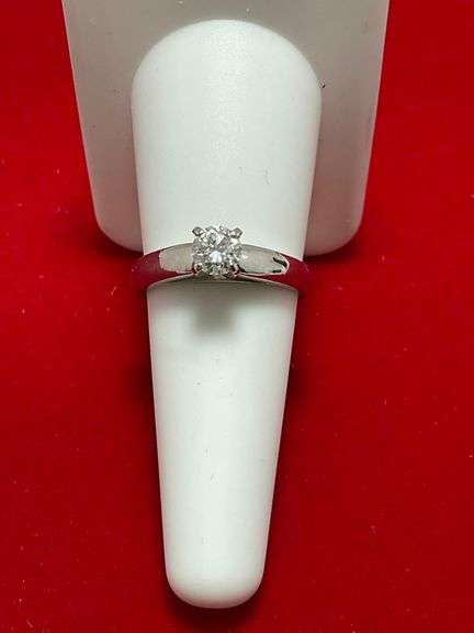CERTIFIED PLATINUM DIAMOND SOLITAIRE RING. 0.57 CARAT