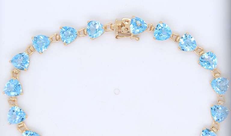 14kt Yellow gold heart shaped blue topaz tennis bracelet