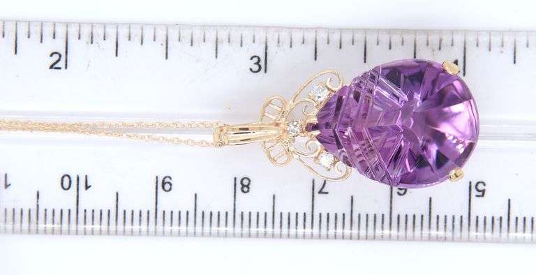 14kt Yellow gold fancy pear shaped amethyst and diamond pendant on chain necklace