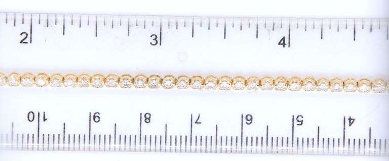 14kt Yellow gold 1ctw diamond bracelet with flip over circle clasp