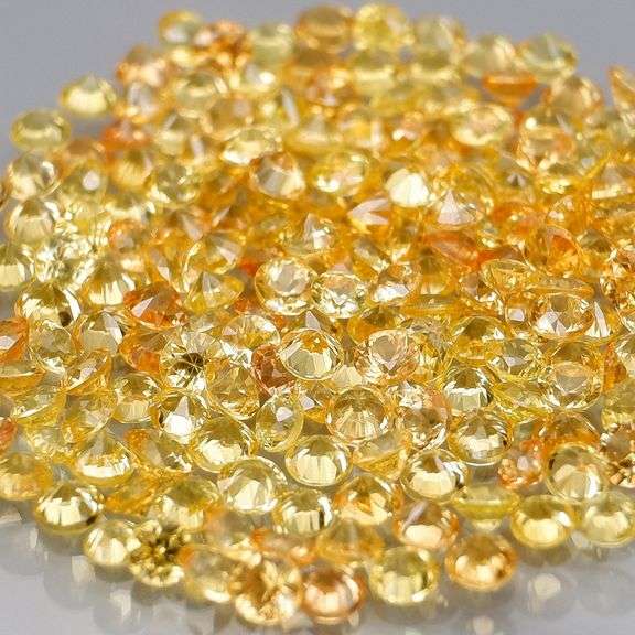 Charming 4.58ct golden yellow round cut Sapphire set