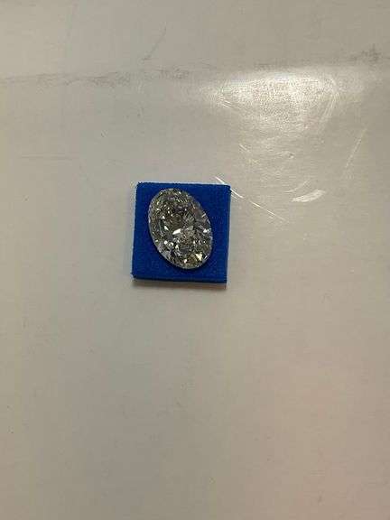 CERTIFIED 5.01 CARAT OVAL SHAPED DIAMOND.